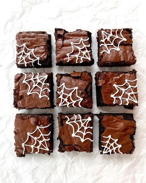 Delicious spider web brownies decorated for Halloween