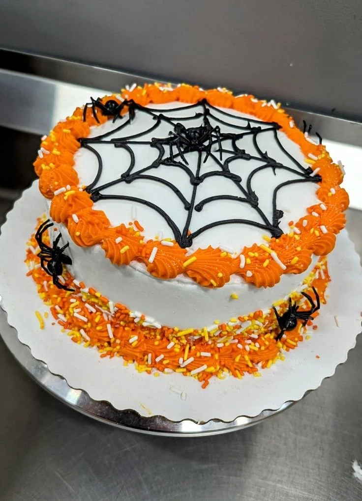 Spooky Spider Web Cake decorated for Halloween with intricate frosting design.