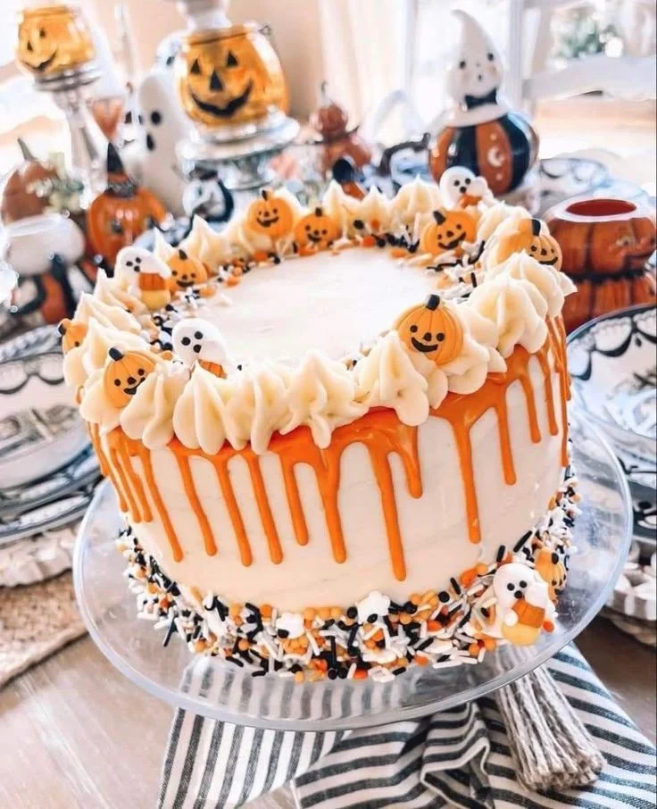 Spooky Halloween cake decorated with orange frosting and drip design