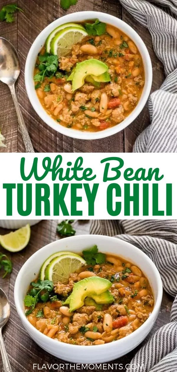 Bowl of white bean turkey chili topped with fresh herbs and served with bread
