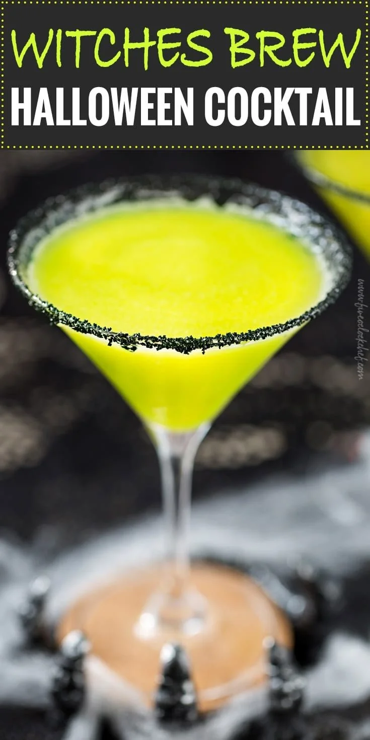 Colorful Witches Brew Halloween cocktail garnished with spooky decorations.